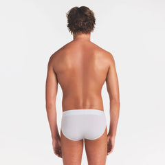 SKIMS STRETCH MENS BRIEF | CHALK ON A MODEL BACK VIEW