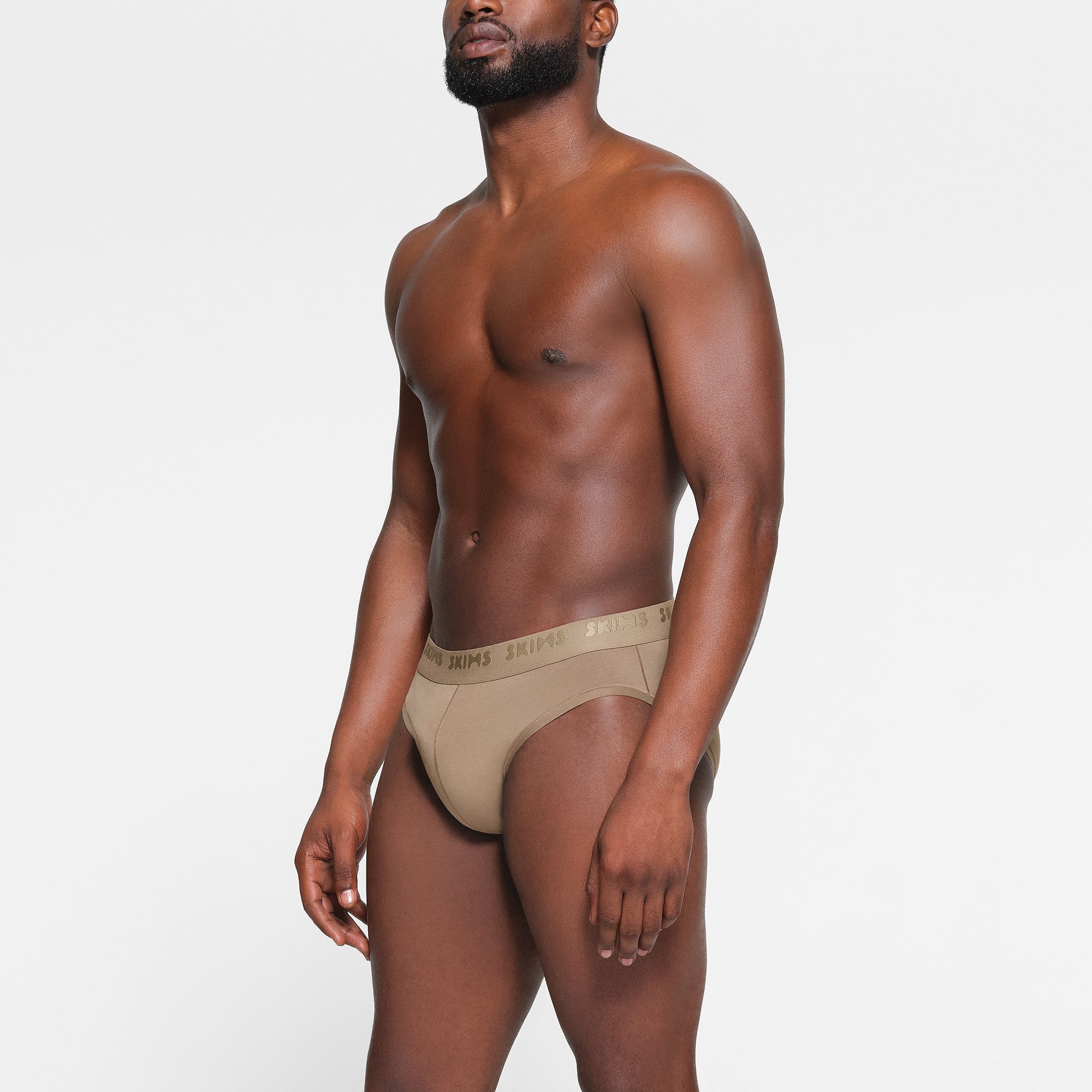 SKIMS STRETCH MENS BRIEF 3-PACK WORN BY A MODEL IN SIDE VIEW