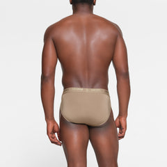SKIMS STRETCH MENS BRIEF 3-PACK ON A MODEL BACK VIEW