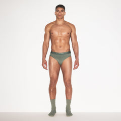 SKIMS STRETCH MENS BRIEF | LAUREL ON A MODEL FRONT VIEW | FOCUS: 0.0, 1.0, 0.9