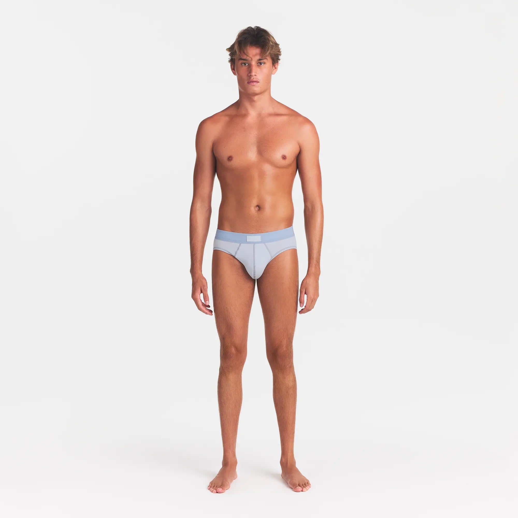 SKIMS COTTON MENS BRIEF | ATMOSPHERE ON A MODEL FRONT VIEW @ | FOCUS: 0.0, 1.0, 0.9
