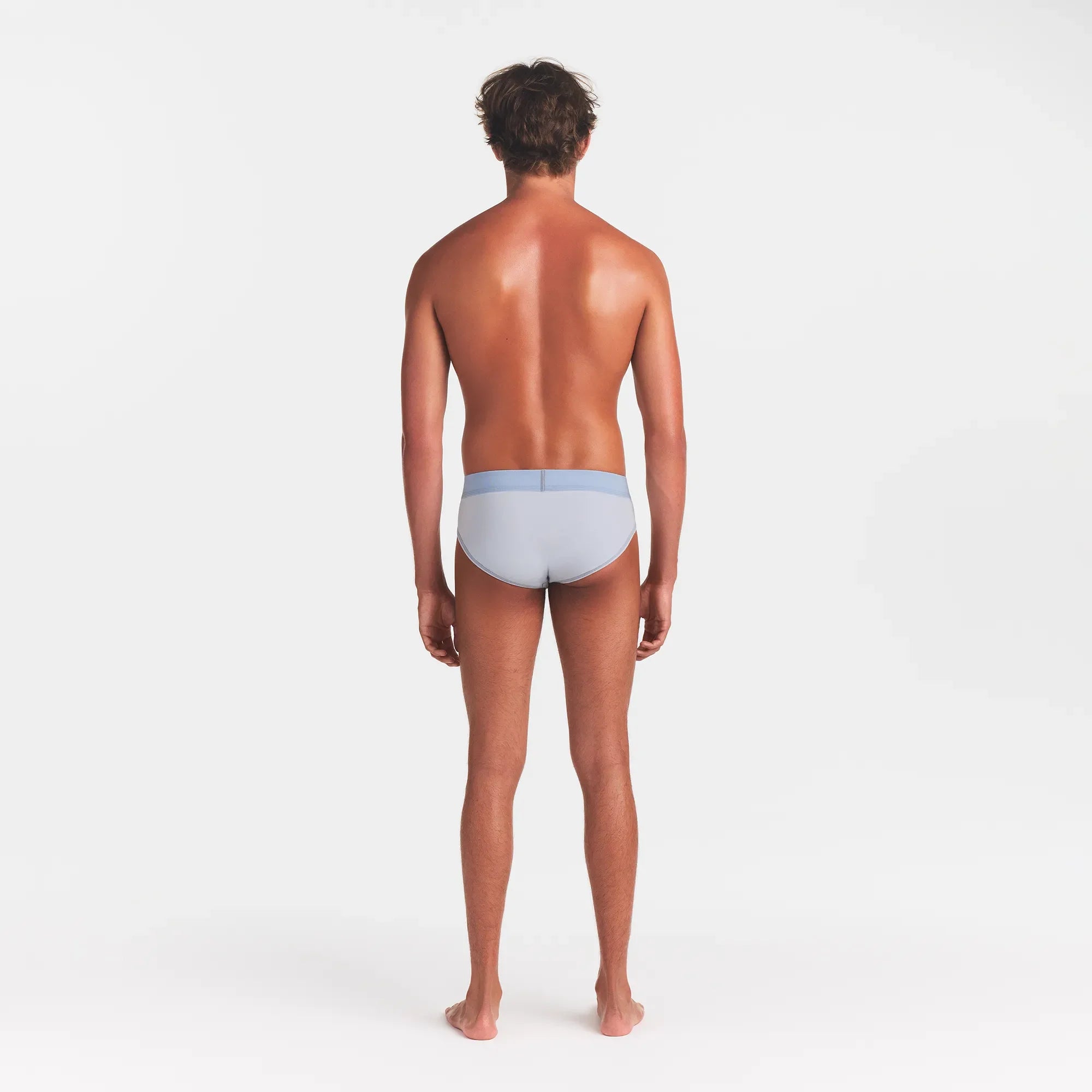 SKIMS COTTON MENS BRIEF | ATMOSPHERE ON A MODEL BACK VIEW @ | FOCUS: 0.0, 1.0, 0.9