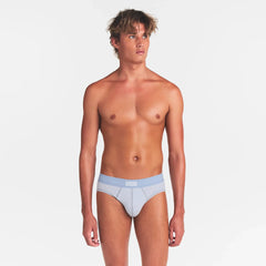 SKIMS COTTON MENS BRIEF | ATMOSPHERE ON A MODEL FRONT VIEW @ | FOCUS: 0.0, 1.0, 0.9
