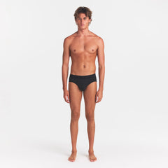 SKIMS COTTON MENS BRIEF | ONYX ON A MODEL FRONT VIEW