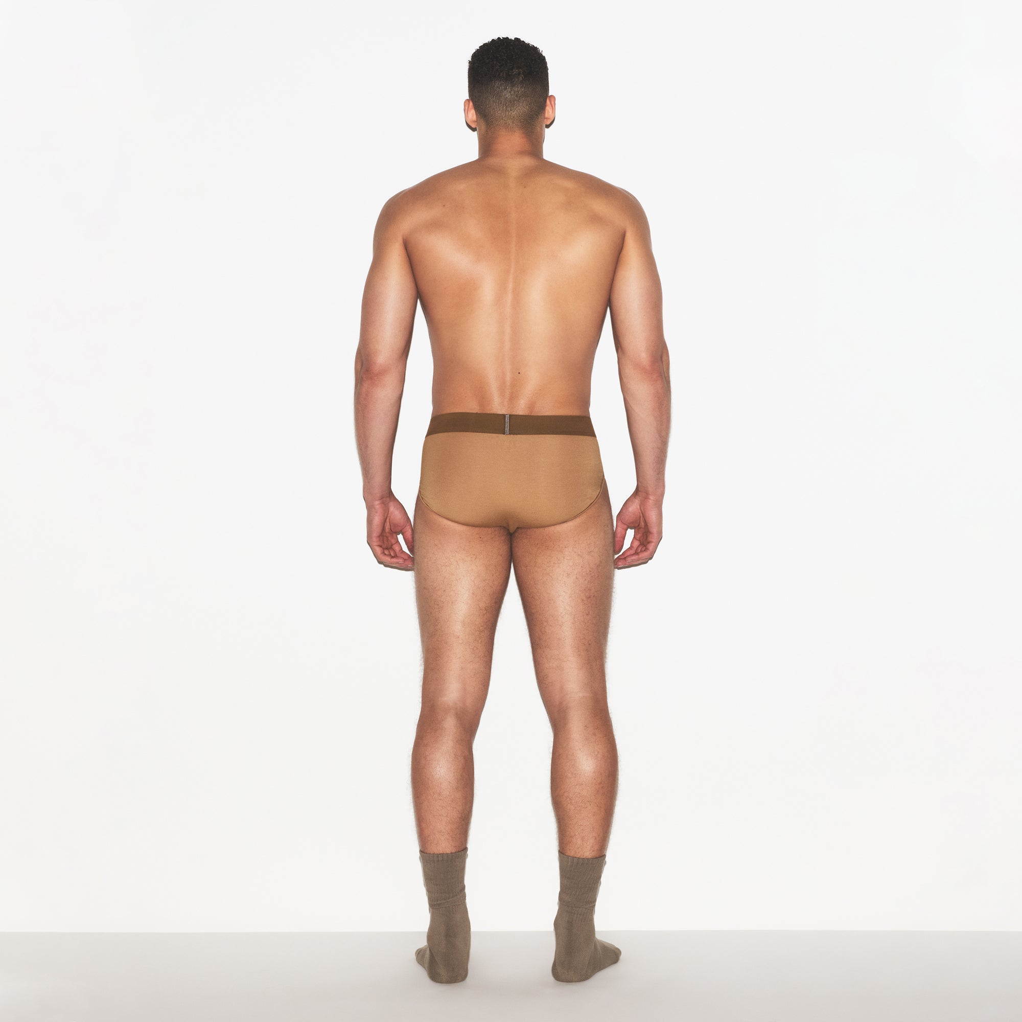 SKIMS COTTON MENS BRIEF | RUSSET ON A MODEL FRONT VIEW | FOCUS: 0.0, 1.0, 0.9