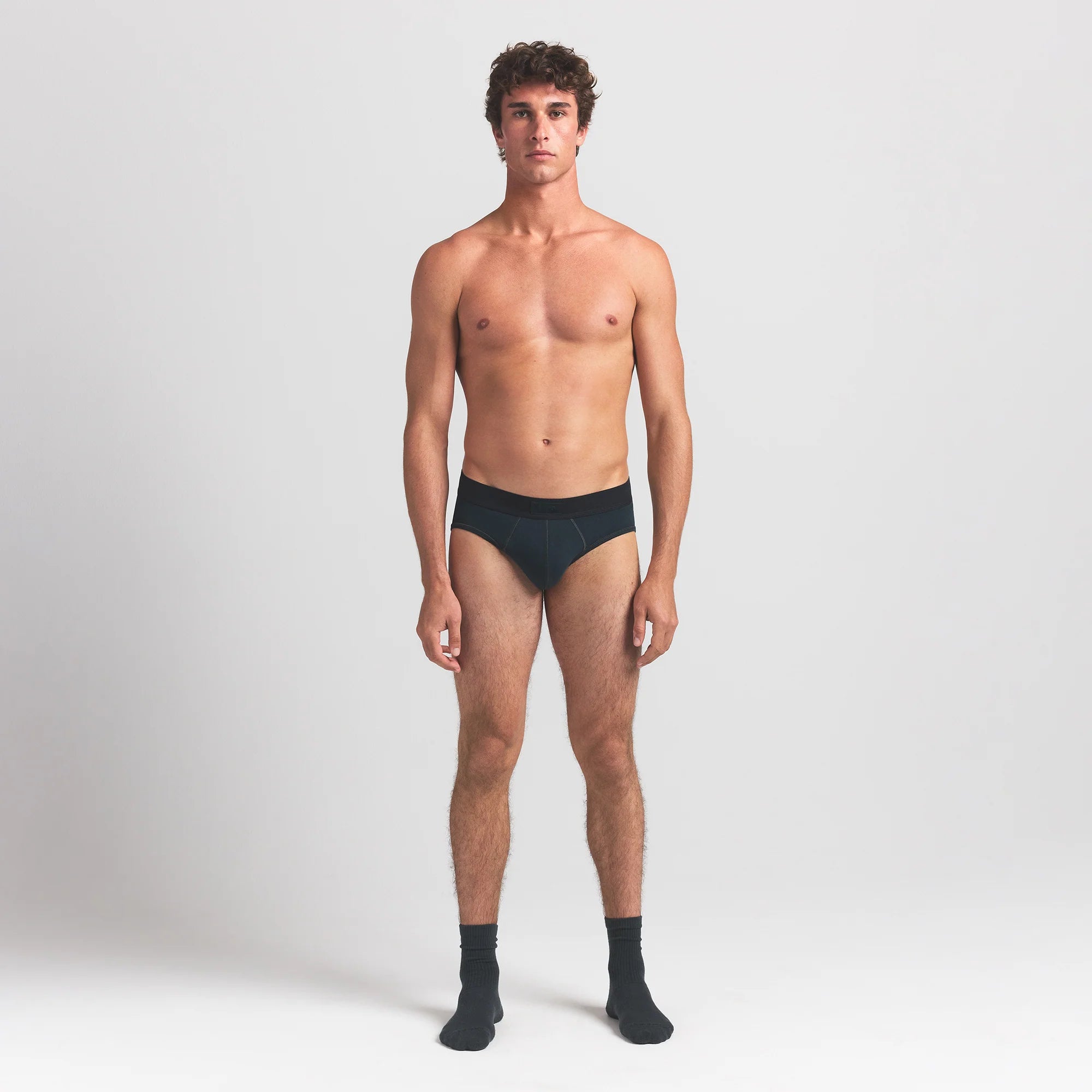 SKIMS COTTON MENS BRIEF | VERDANT ON A MODEL FRONT VIEW @ | FOCUS: 0.0, 1.0, 0.9