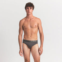 SKIMS STRETCH MENS BRIEF 3-PACK | GUNMETAL MULTI ON A MODEL FRONT VIEW
