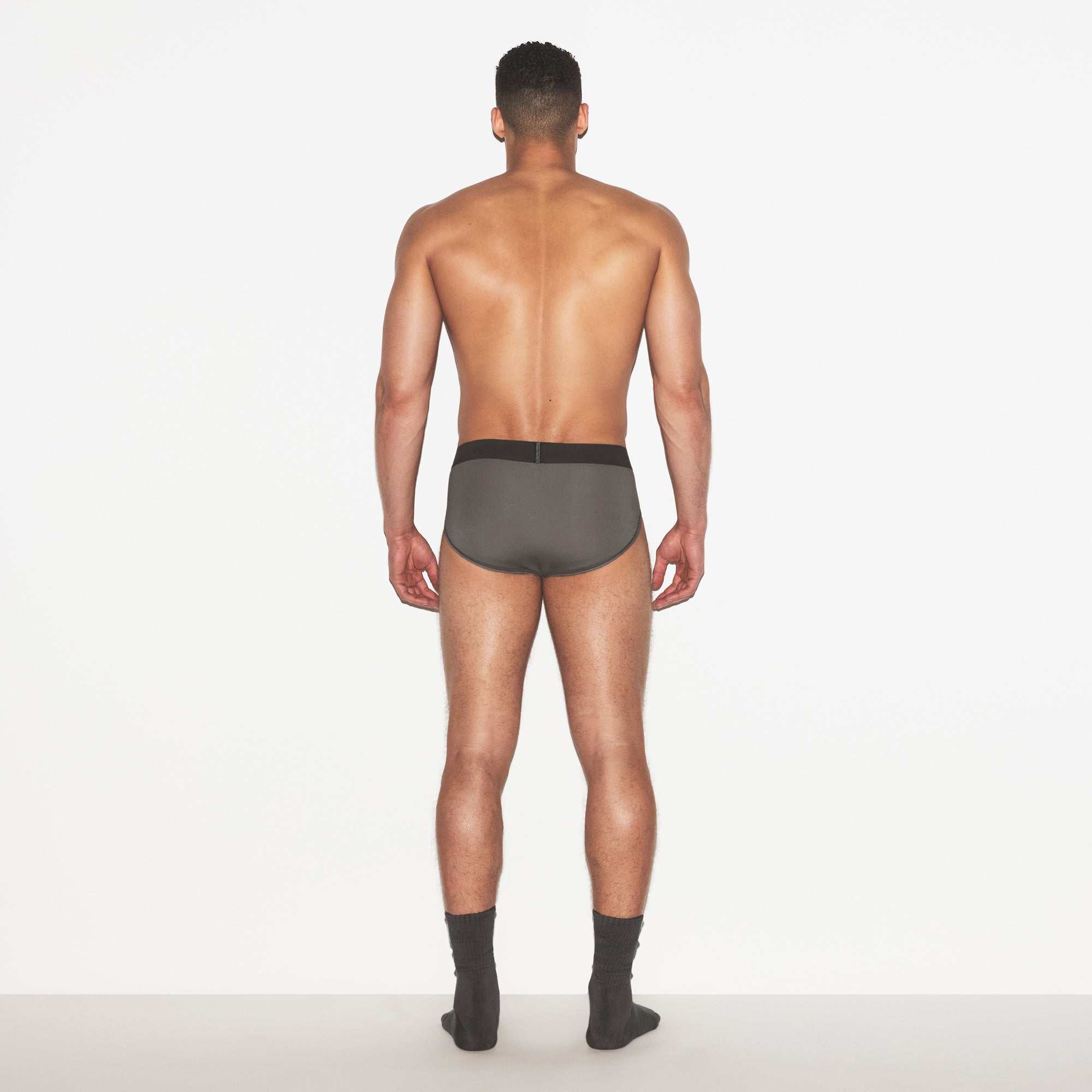 SKIMS COTTON MENS BRIEF 3-PACK | HEATHER MULTI ON A MODEL FRONT VIEW | FOCUS: 0.0, 1.0, 0.9