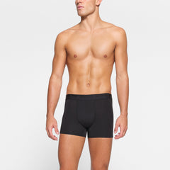 SKIMS STRETCH MENS 3" BOXER BRIEF 3-PACK WORN BY A MODEL IN FRONT VIEW