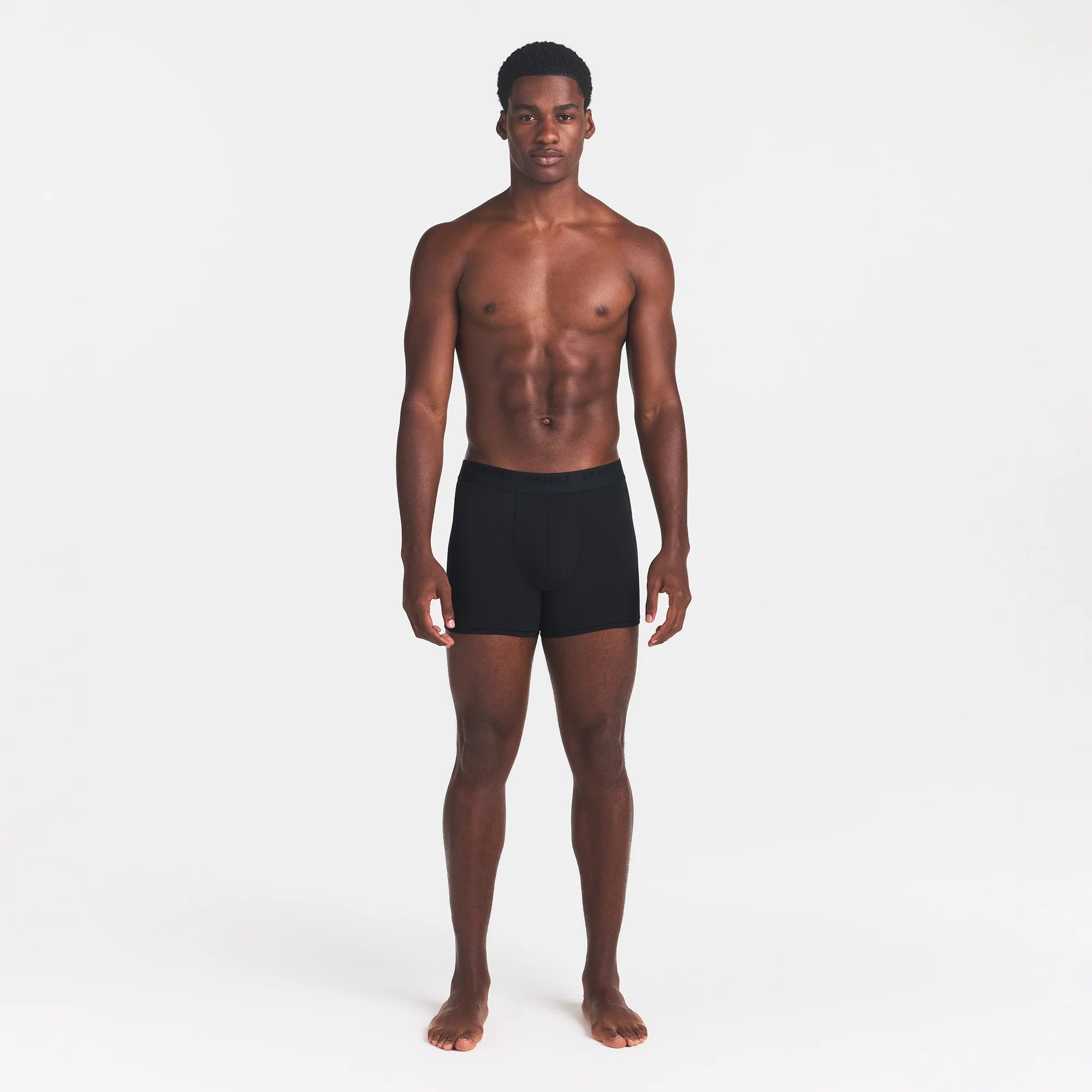 SKIMS STRETCH MENS 3" BOXER BRIEF | OBSIDIAN ON A MODEL FRONT VIEW @ | FOCUS: 0.0, 1.0, 0.9