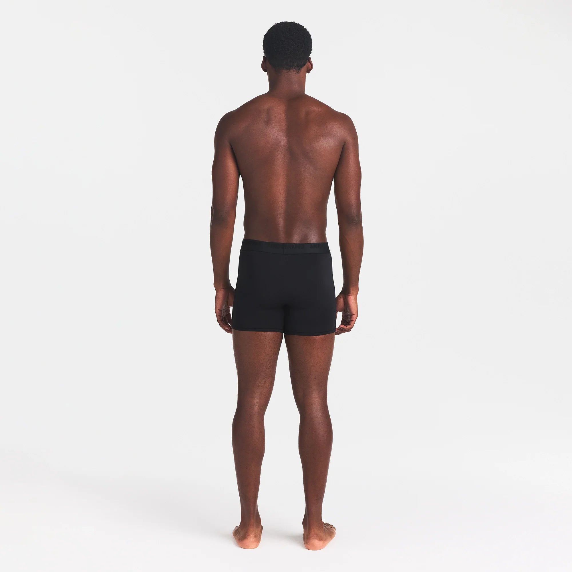 SKIMS STRETCH MENS 3" BOXER BRIEF | OBSIDIAN ON A MODEL BACK VIEW