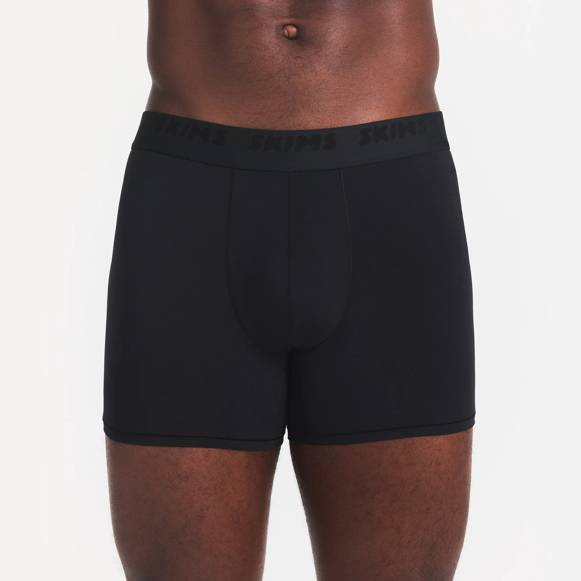 SKIMS STRETCH MENS 3" BOXER BRIEF | OBSIDIAN ON A MODEL FRONT VIEW