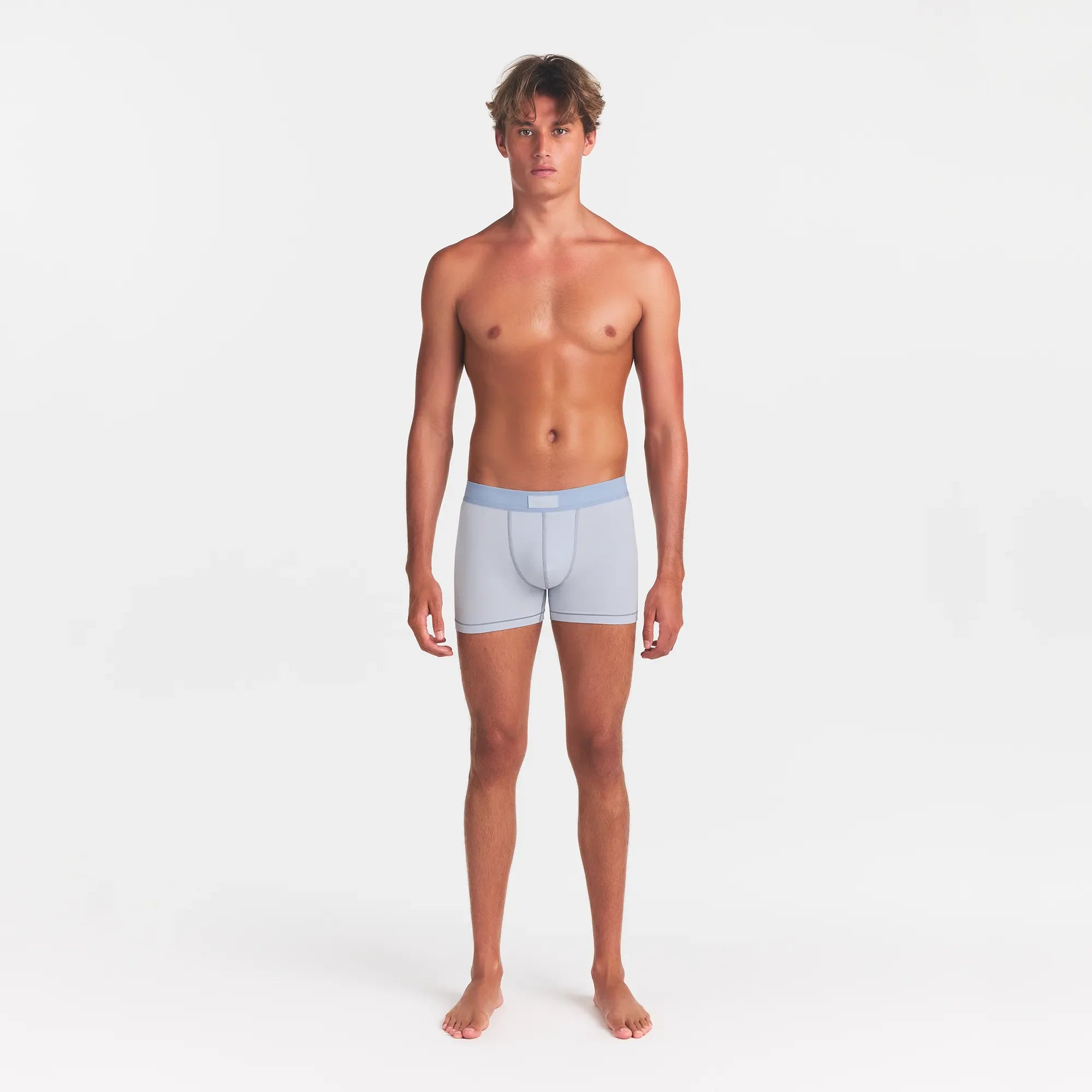 SKIMS COTTON MENS 3" BOXER BRIEF | ATMOSPHERE ON A MODEL FRONT VIEW @ | FOCUS: 0.0, 1.0, 0.9