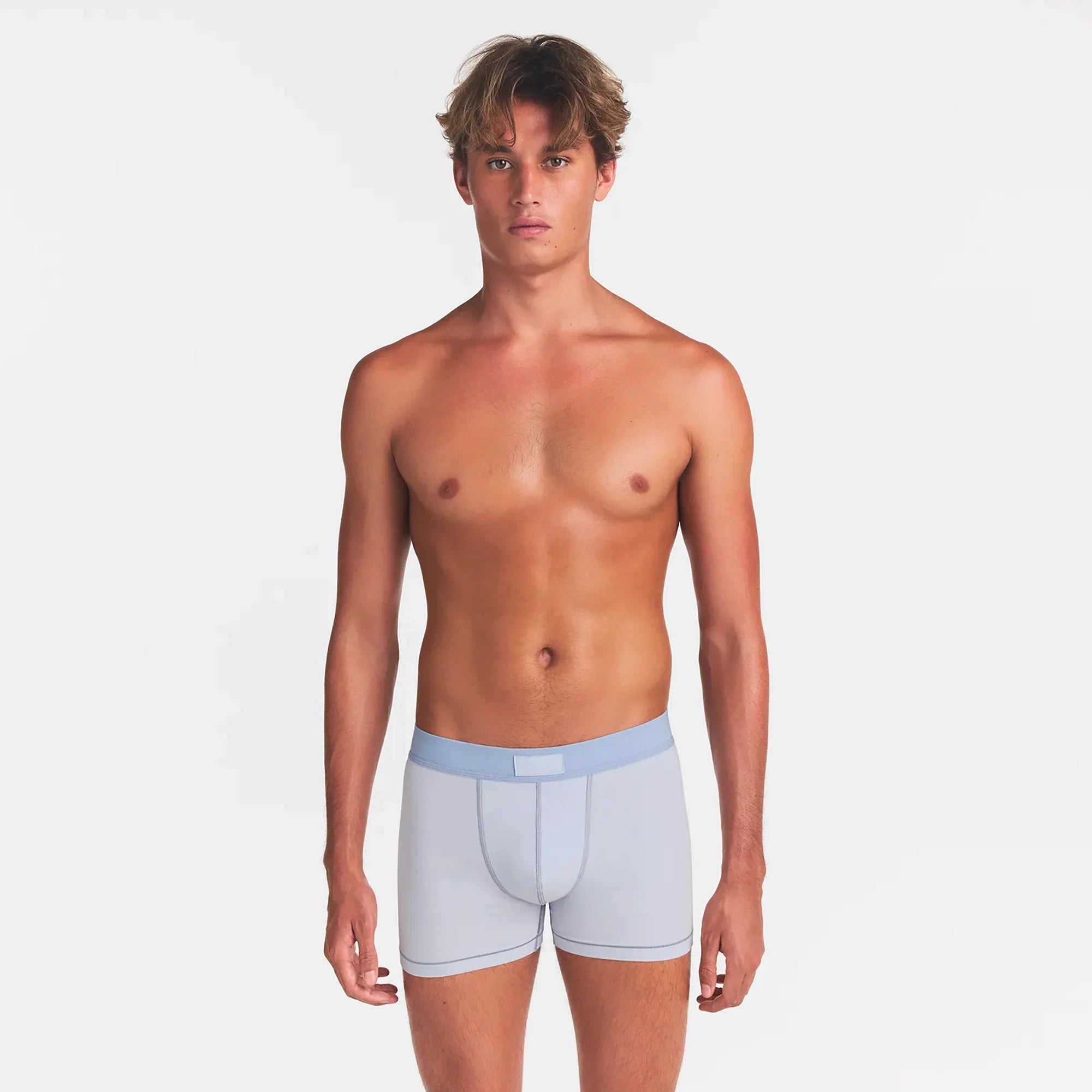 SKIMS COTTON MENS 3" BOXER BRIEF | ATMOSPHERE ON A MODEL FRONT VIEW