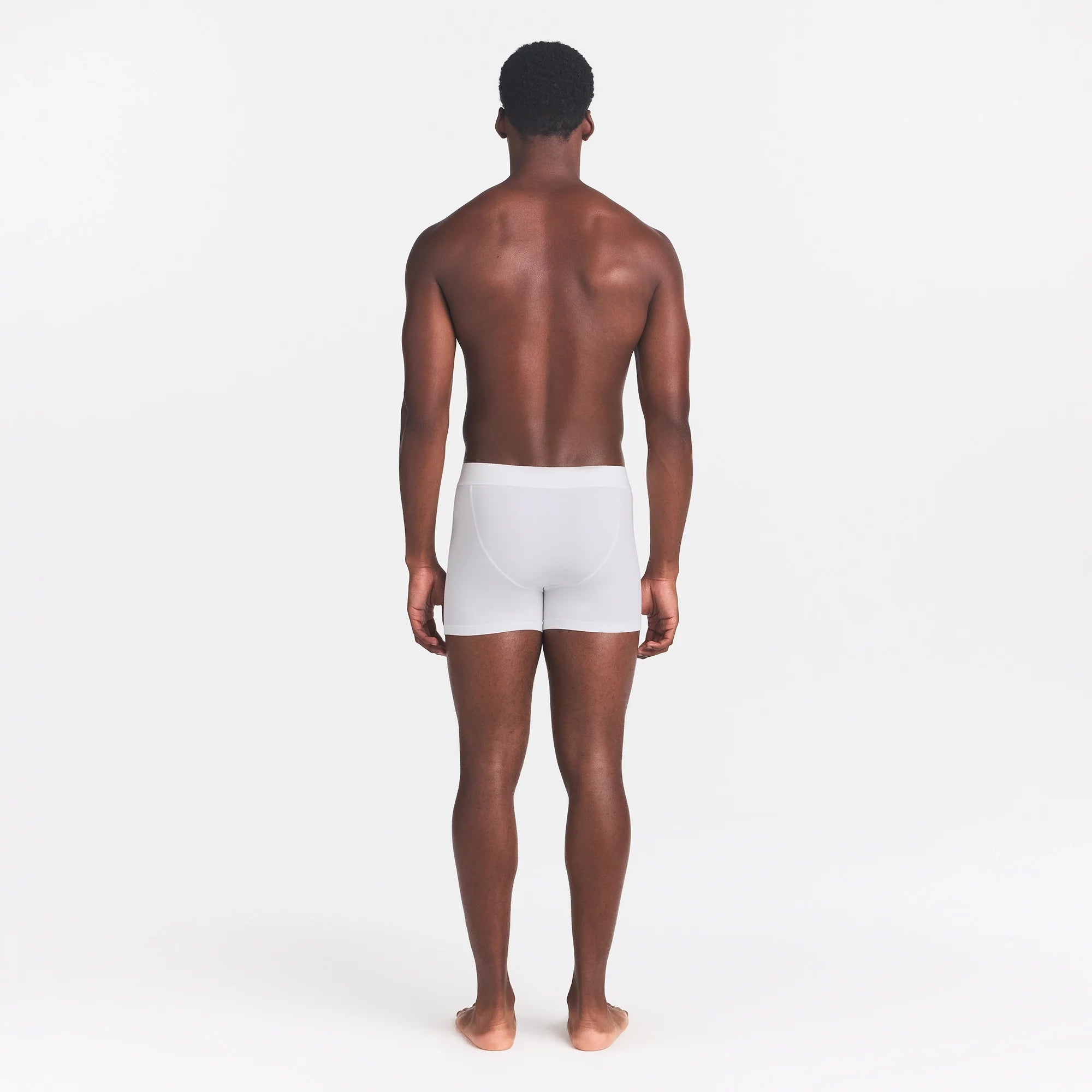 SKIMS COTTON MENS 3" BOXER BRIEF | CHALK ON A MODEL BACK VIEW