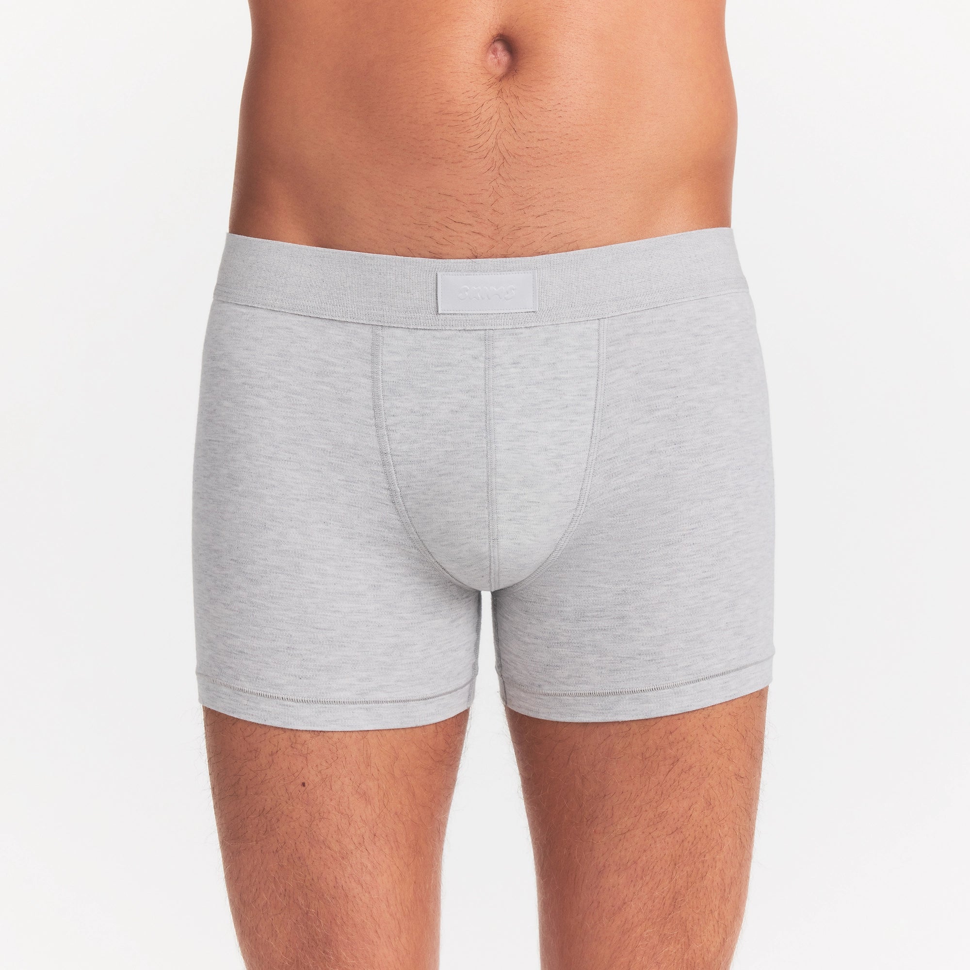 SKIMS COTTON MENS 3" BOXER BRIEF | LIGHT HEATHER GREY ON A MODEL FRONT VIEW