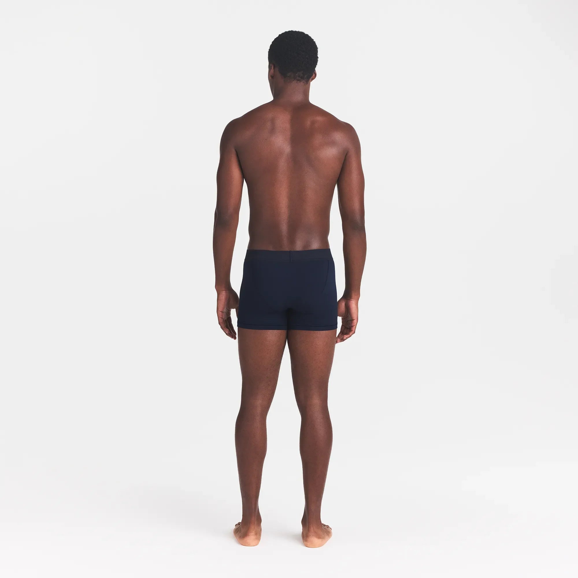 SKIMS COTTON MENS 3" BOXER BRIEF | NAVY ON A MODEL BACK VIEW