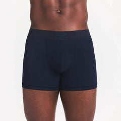 SKIMS COTTON MENS 3" BOXER BRIEF | NAVY ON A MODEL FRONT VIEW