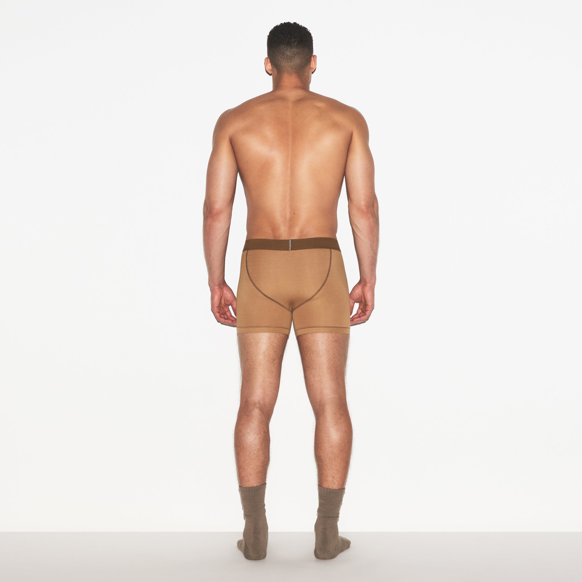 SKIMS COTTON MENS 3 INCH BOXER BRIEF | RUSSET ON A MODEL FRONT VIEW | FOCUS: 0.0, 1.0, 0.9