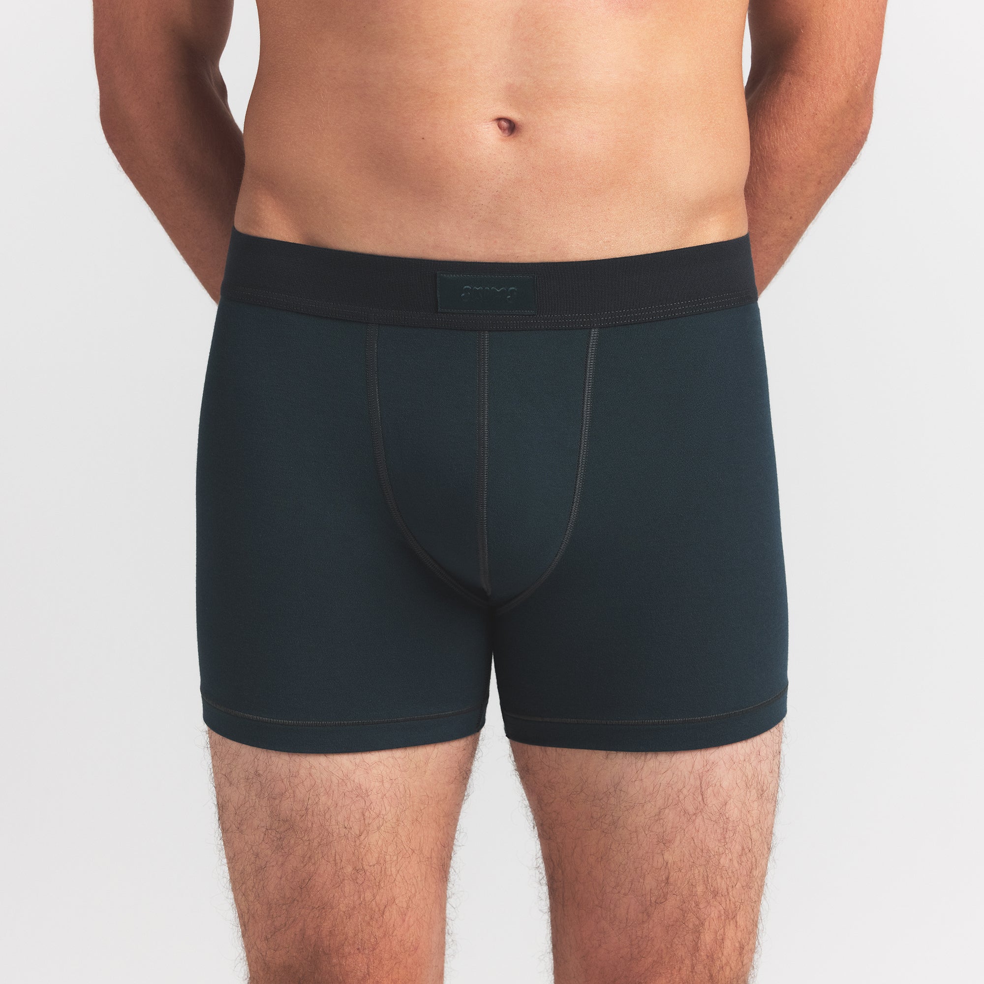 SKIMS COTTON MENS 3" BOXER BRIEF | VERDANT ON A MODEL FRONT VIEW @ | FOCUS: 0.0, 1.0, 0.9