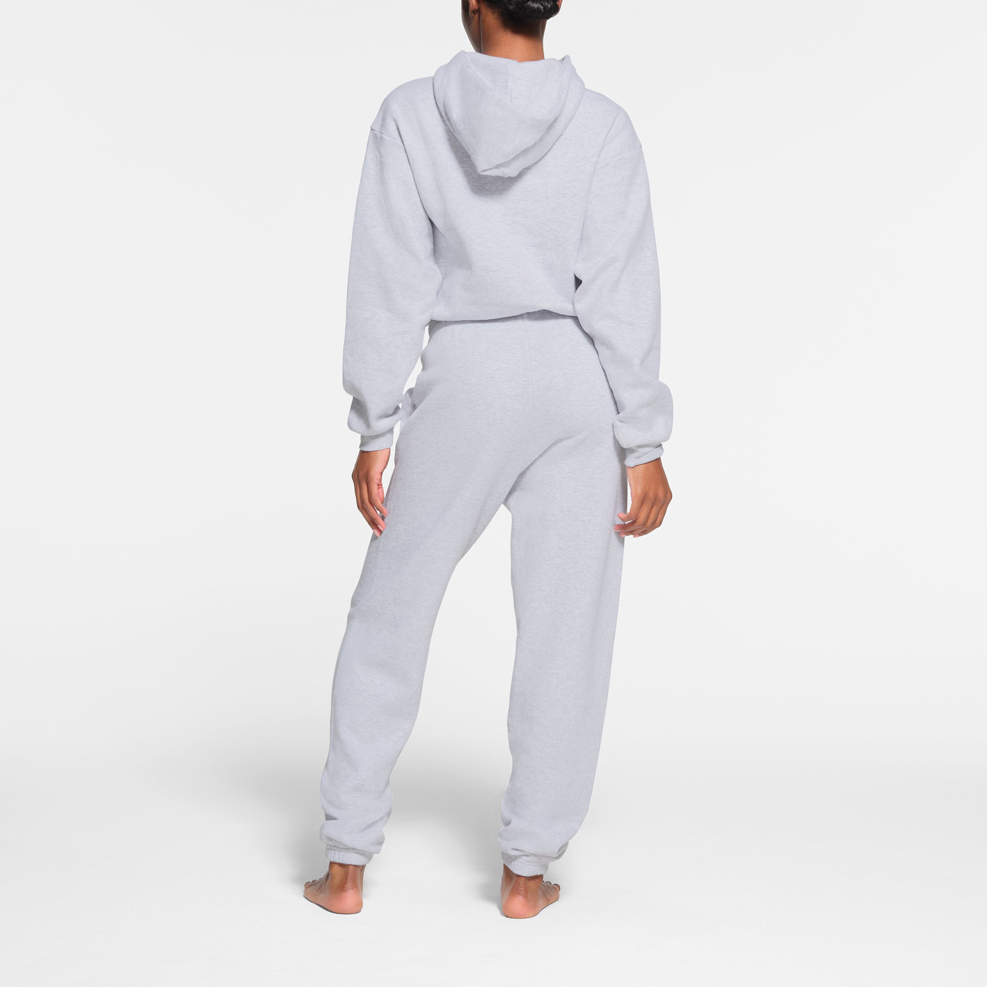 COTTON FLEECE CLASSIC JOGGER | LIGHT HEATHER GREY ON A MODEL BACK VIEW