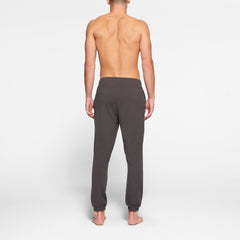 LOUNGE JERSEY MENS JOGGER | ASH ON A MODEL BACK VIEW @ | FOCUS: 0.9, 0.1, 0.7