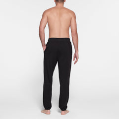 JERSEY LOUNGE MENS JOGGER | OBSIDIAN ON A MODEL BACK VIEW @ | FOCUS: 0.9, 0.1, 0.7