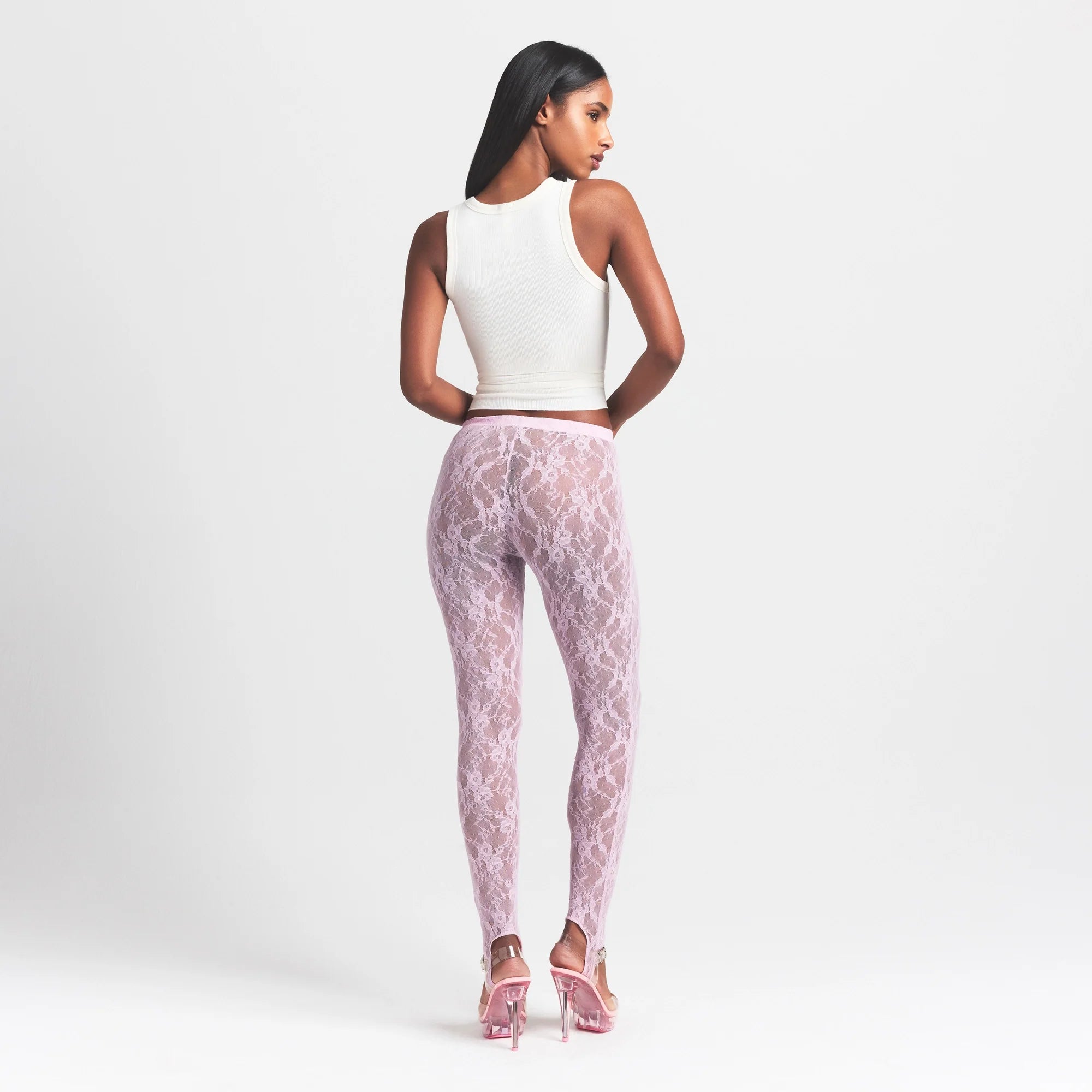 STRETCH LACE STIRRUP LEGGING | BABY PINK ON A MODEL FRONT VIEW @ | FOCUS: 0.0, 1.0, 0.9