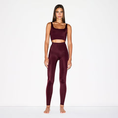 NikeSKIMS SHINE DRAWCORD 26" LEGGING | CURRANT ON A MODEL FRONT VIEW @ | FOCUS: 0.0, 1.0, 0.9