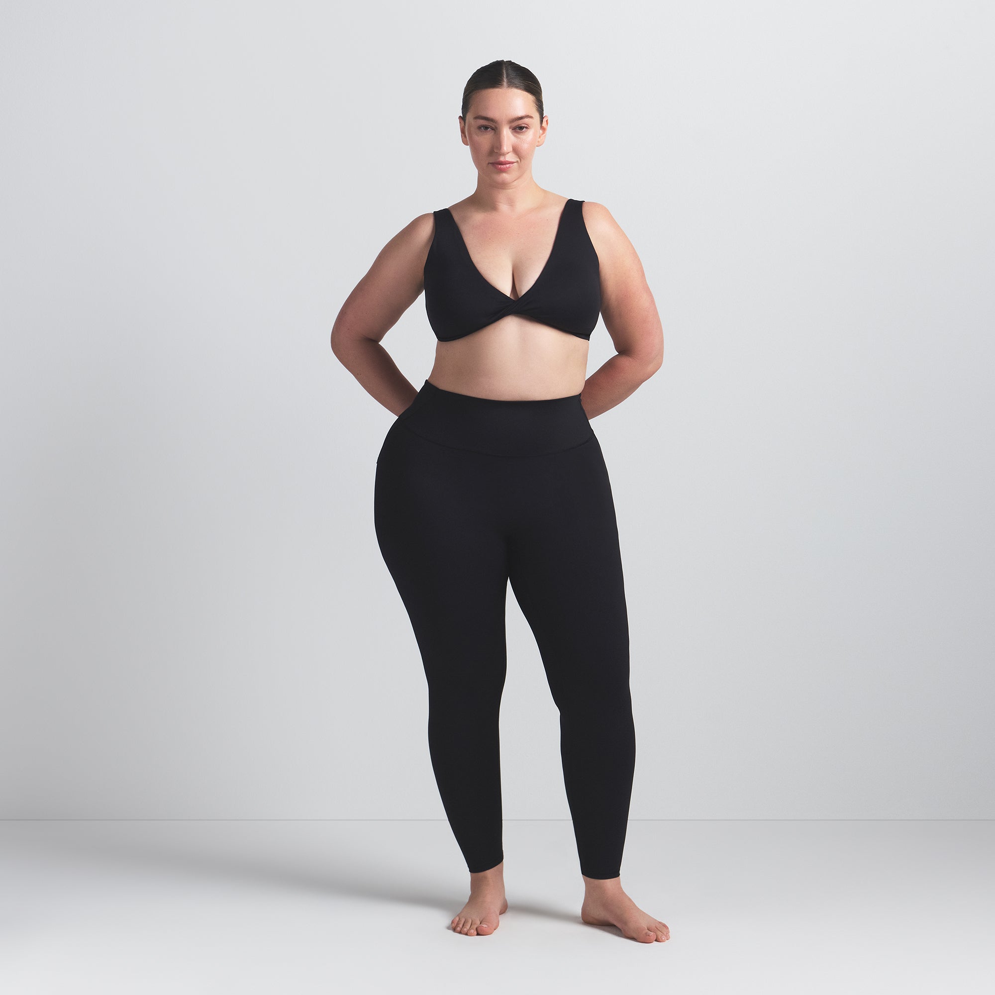 NikeSKIMS MATTE 26" LEGGING | OBSIDIAN ON A MODEL FRONT VIEW