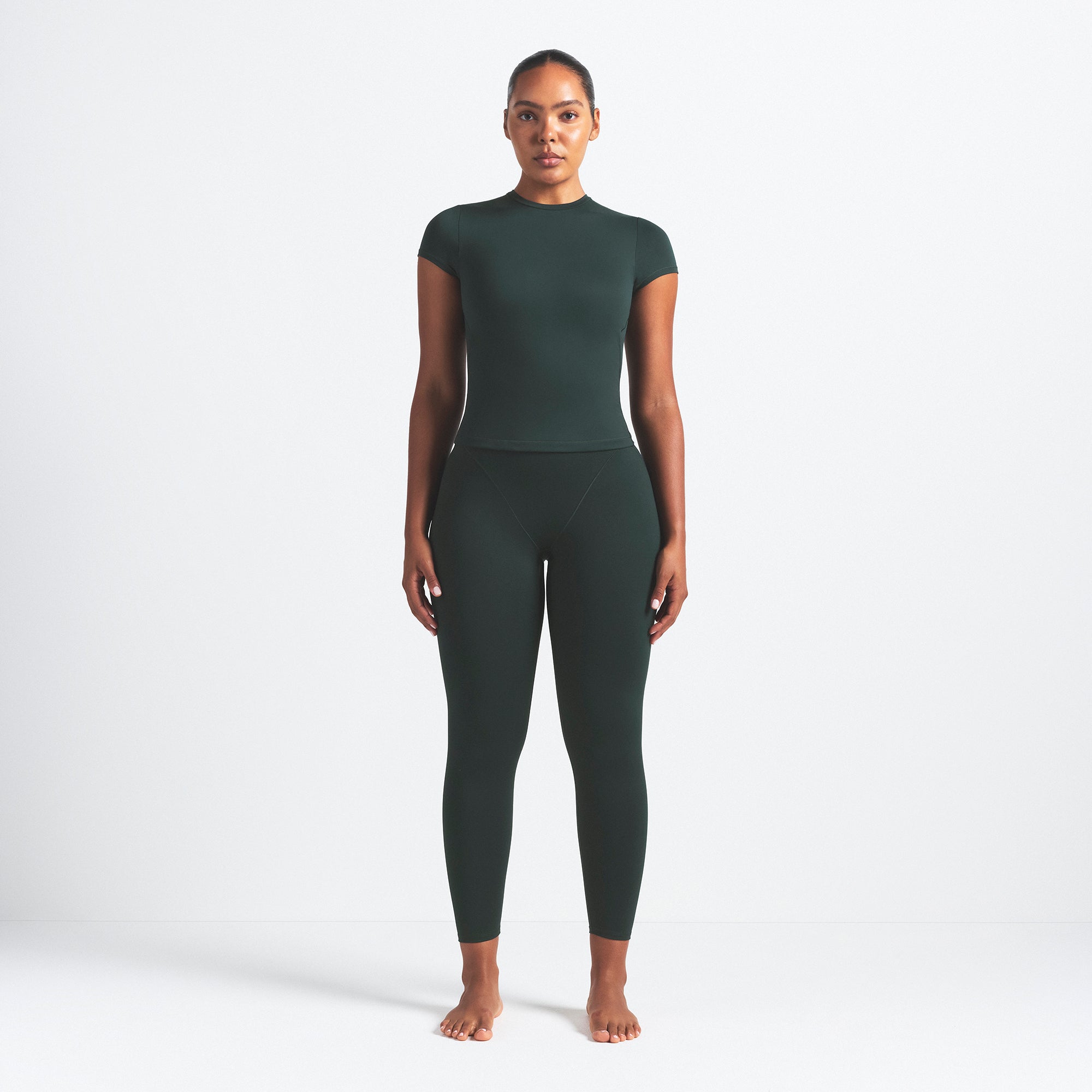 NikeSKIMS MATTE V-LINE 26" LEGGING | DARK TEAL ON A MODEL FRONT VIEW @ | FOCUS: 0.0, 1.0, 0.9