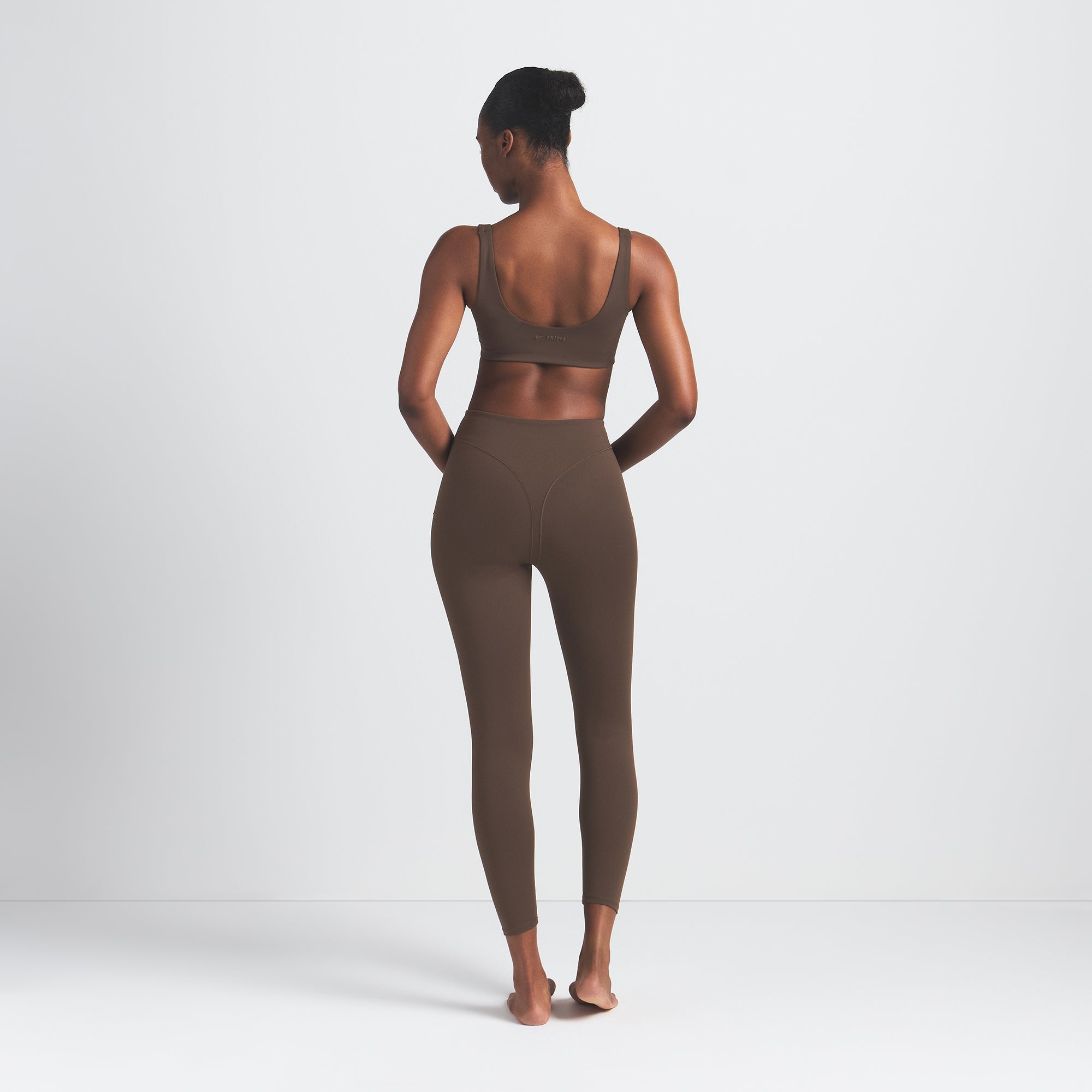 NikeSKIMS MATTE V-LINE 26" LEGGING | DARK SEPIA ON A MODEL BACK VIEW