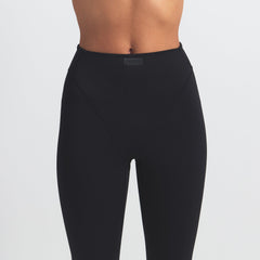 NikeSKIMS MATTE V-LINE 26" LEGGING | OBSIDIAN ON A MODEL FRONT VIEW