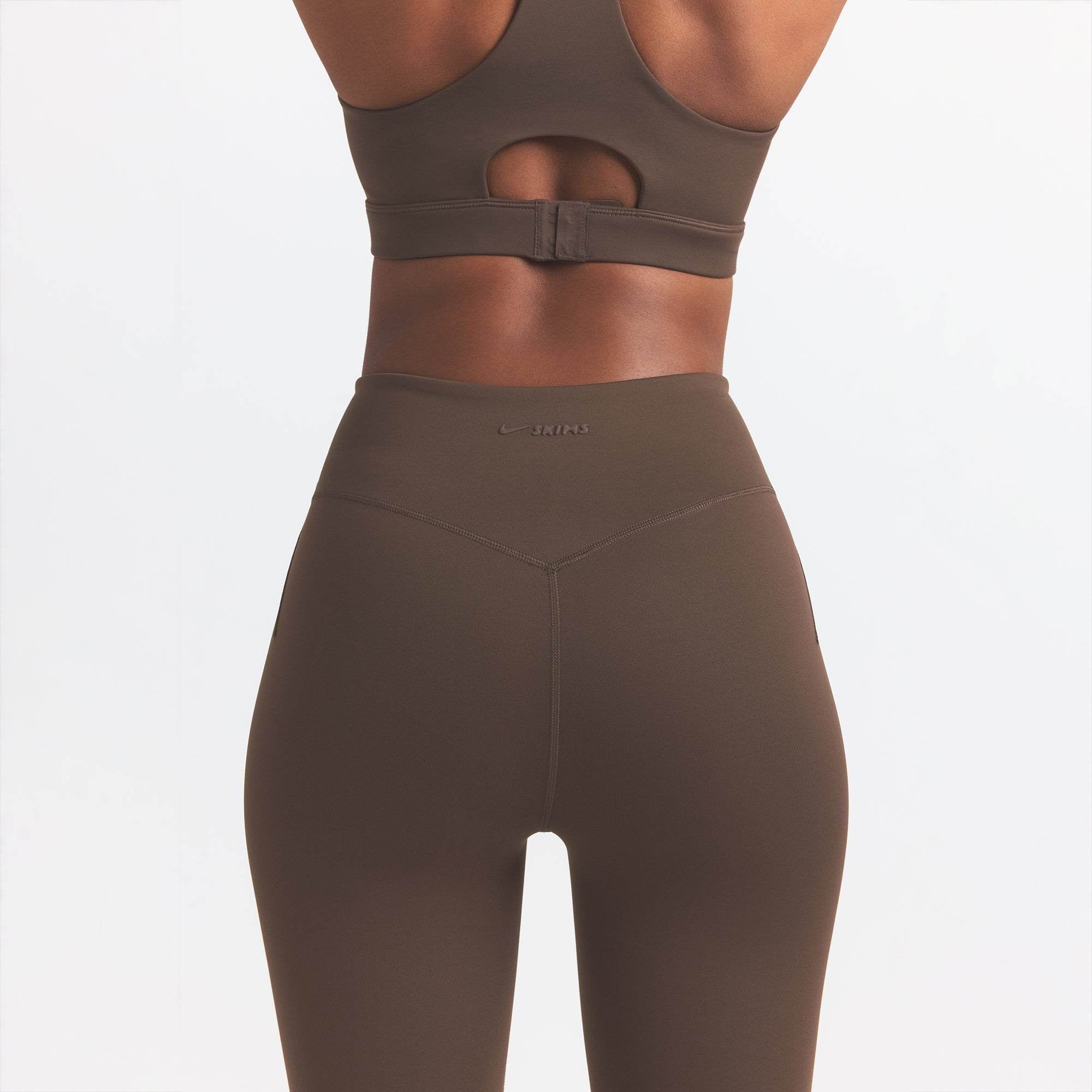 NikeSKIMS MATTE 29" LEGGING | DARK SEPIA ON A MODEL BACK VIEW