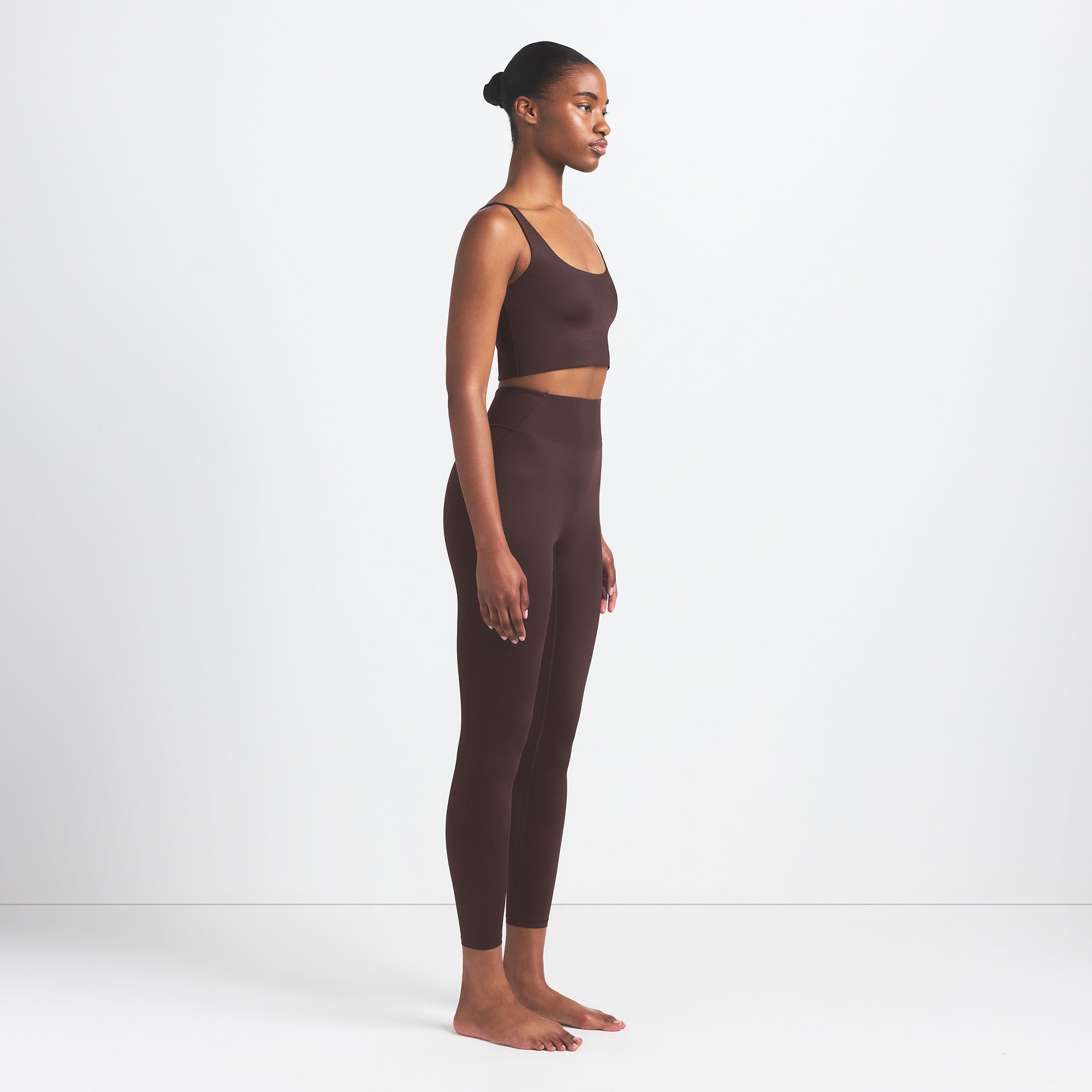 NikeSKIMS SHINE BONDED WAIST 26" LEGGING | PHOENIX ON A MODEL FRONT VIEW