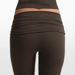 NikeSKIMS MATTE FOLDOVER SLIM FLARE LEGGING | DARK SEPIA ON A MODEL FRONT VIEW @ | FOCUS: 0.0, 1.0, 0.9
