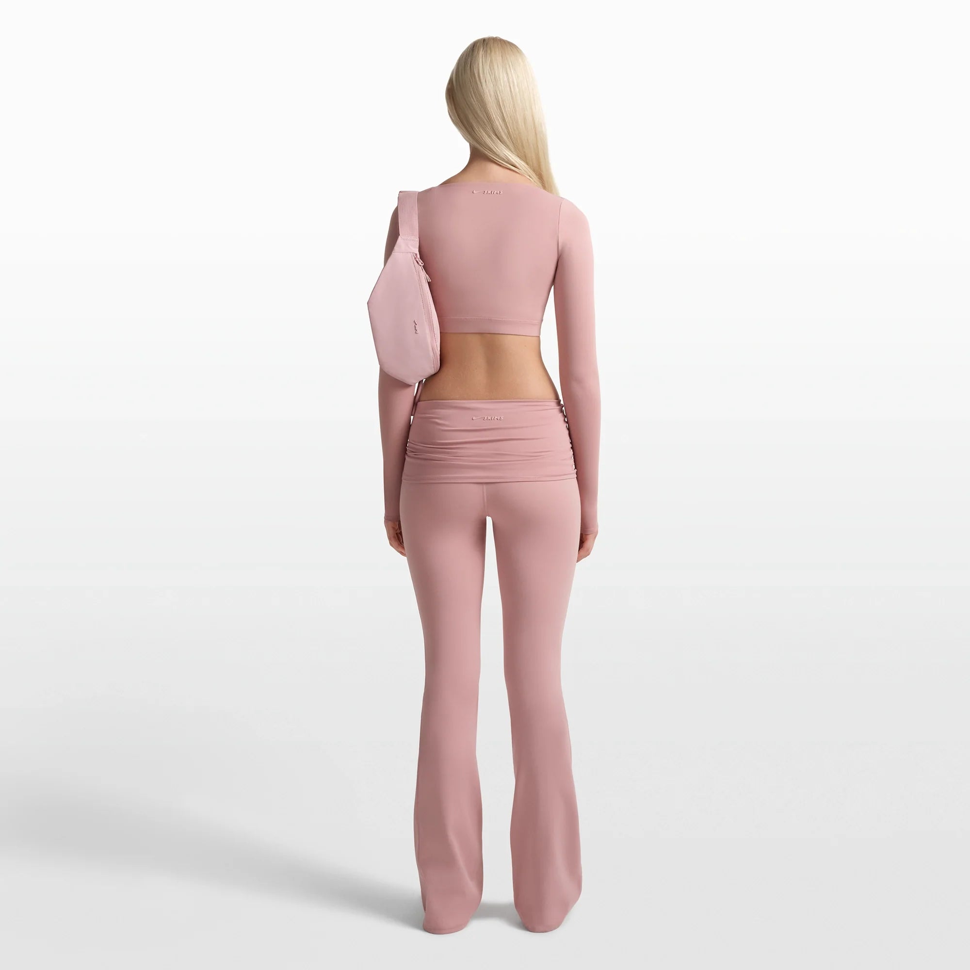 NikeSKIMS MATTE FOLDOVER SLIM FLARE LEGGING | HIMALAYAN ON A MODEL FRONT VIEW @ | FOCUS: 0.0, 1.0, 0.9