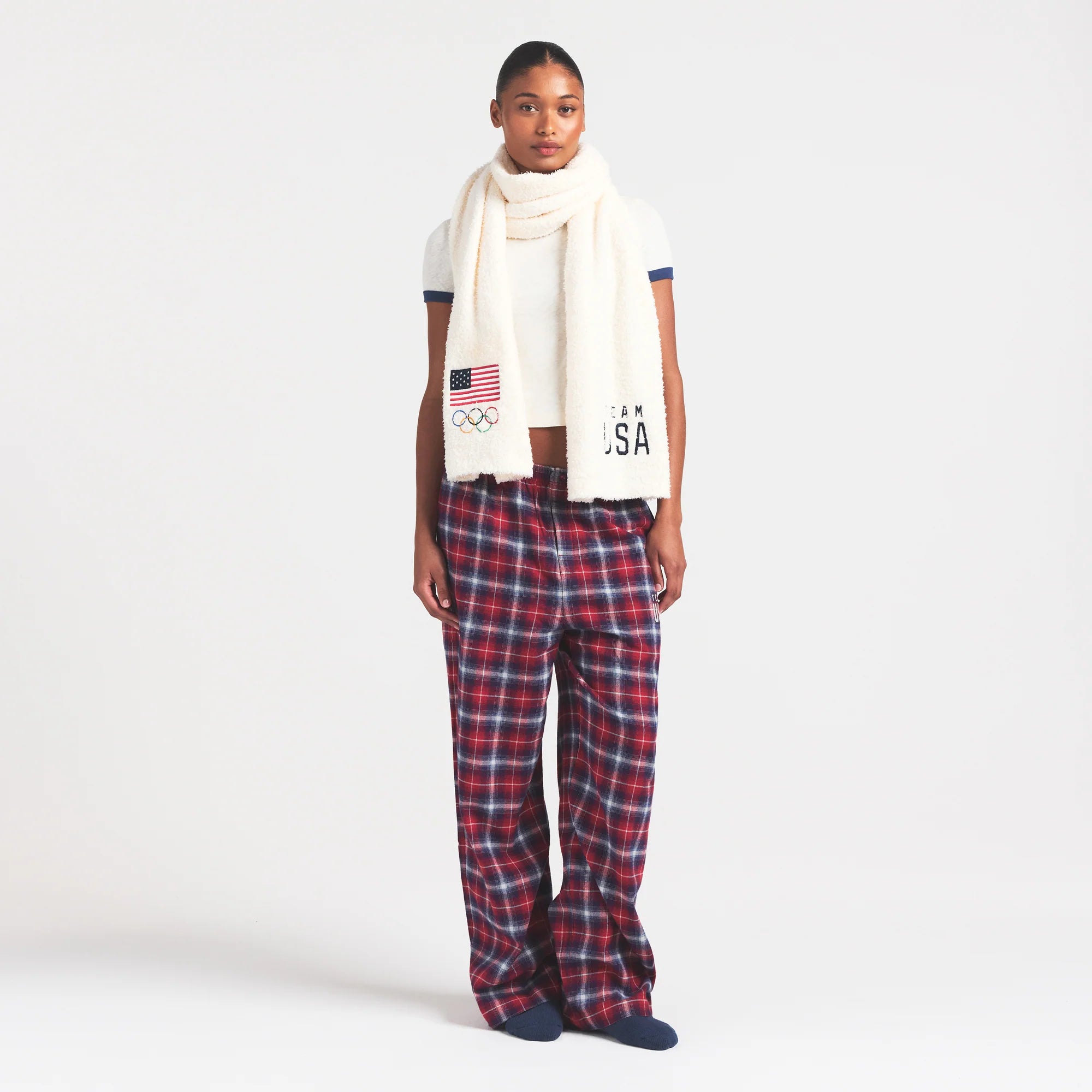 SKIMS FOR TEAM USA FLANNEL SLEEP OLYMPIC PANT | RED PLAID ON A MODEL FRONT VIEW @ | FOCUS: 0.0, 1.0, 0.9