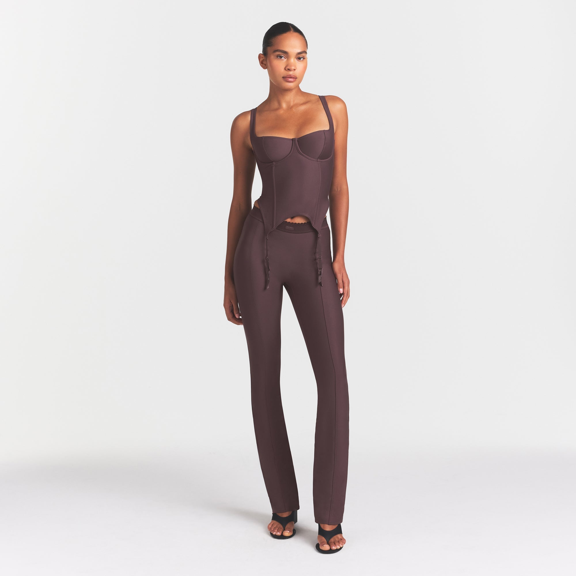 SKIMS BODY HIGH-WAISTED FLARE PANT | RAISIN ON A MODEL FRONT VIEW @