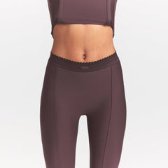 SKIMS BODY HIGH-WAISTED FLARE PANT | RAISIN ON A MODEL SIDE VIEW @