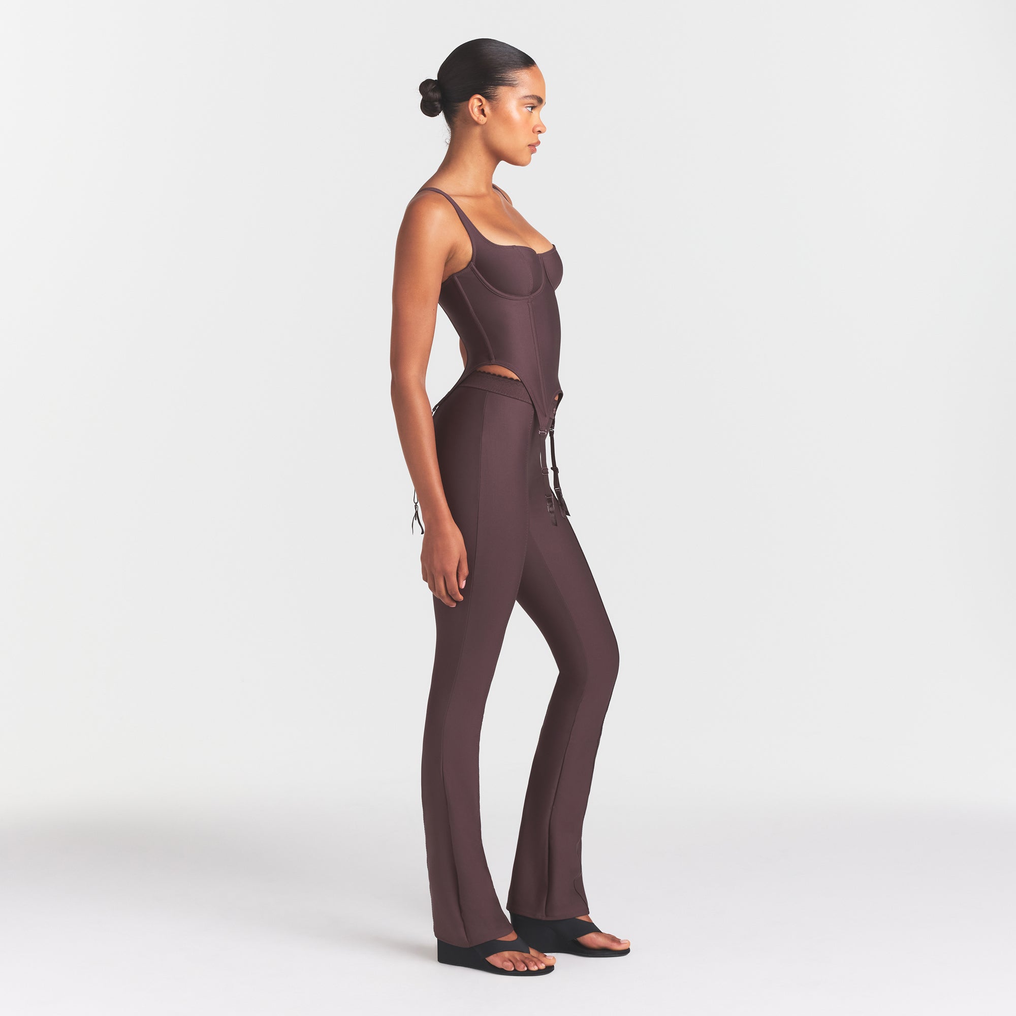 SKIMS BODY HIGH-WAISTED FLARE PANT | RAISIN ON A MODEL FRONT VIEW @