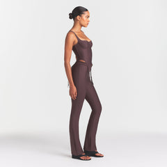 SKIMS BODY HIGH-WAISTED FLARE PANT | RAISIN ON A MODEL FRONT VIEW @