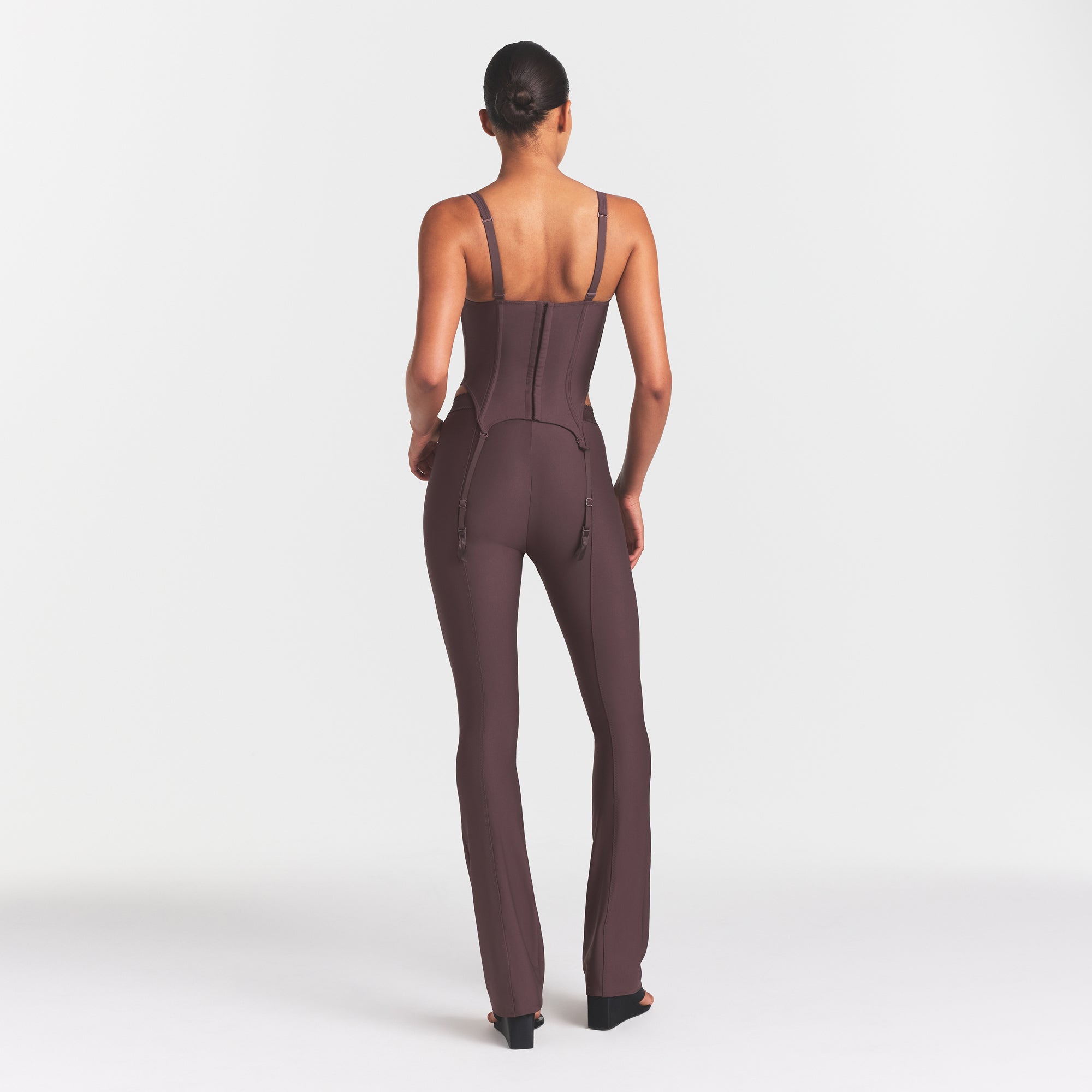 SKIMS BODY HIGH-WAISTED FLARE PANT | RAISIN ON A MODEL FRONT VIEW @