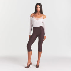 SKIMS BODY HIGH-WAISTED CAPRI | RAISIN ON A MODEL FRONT VIEW @