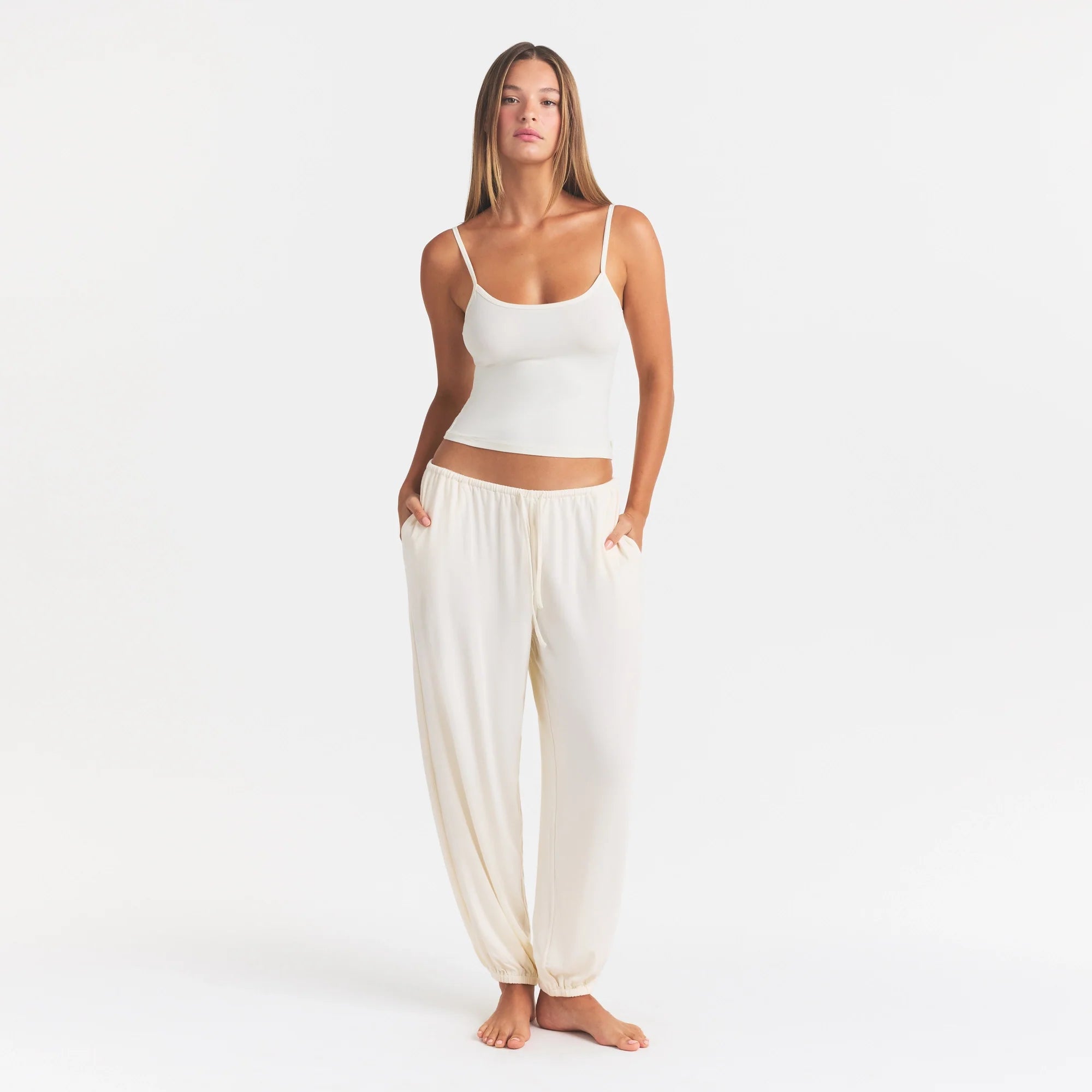 SKIMS SLEEP JOGGER | ECRU ON A MODEL FRONT VIEW @ | FOCUS: 0.0, 1.0, 0.9