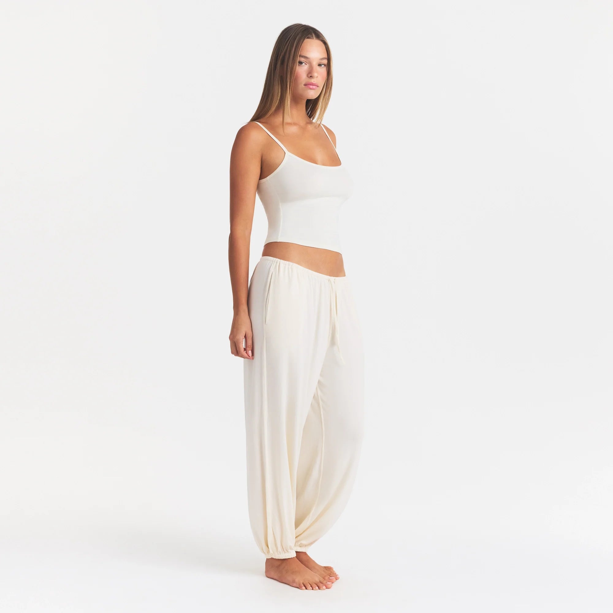 SKIMS SLEEP JOGGER | ECRU ON A MODEL FRONT VIEW @ | FOCUS: 0.0, 1.0, 0.9