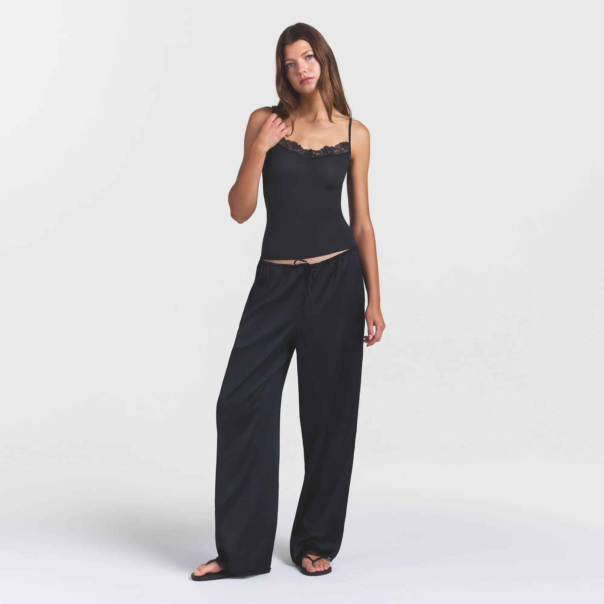 WOVEN SHINE LACE PANT | ONYX ON A MODEL FRONT VIEW @ | FOCUS: 0.0, 1.0, 0.9