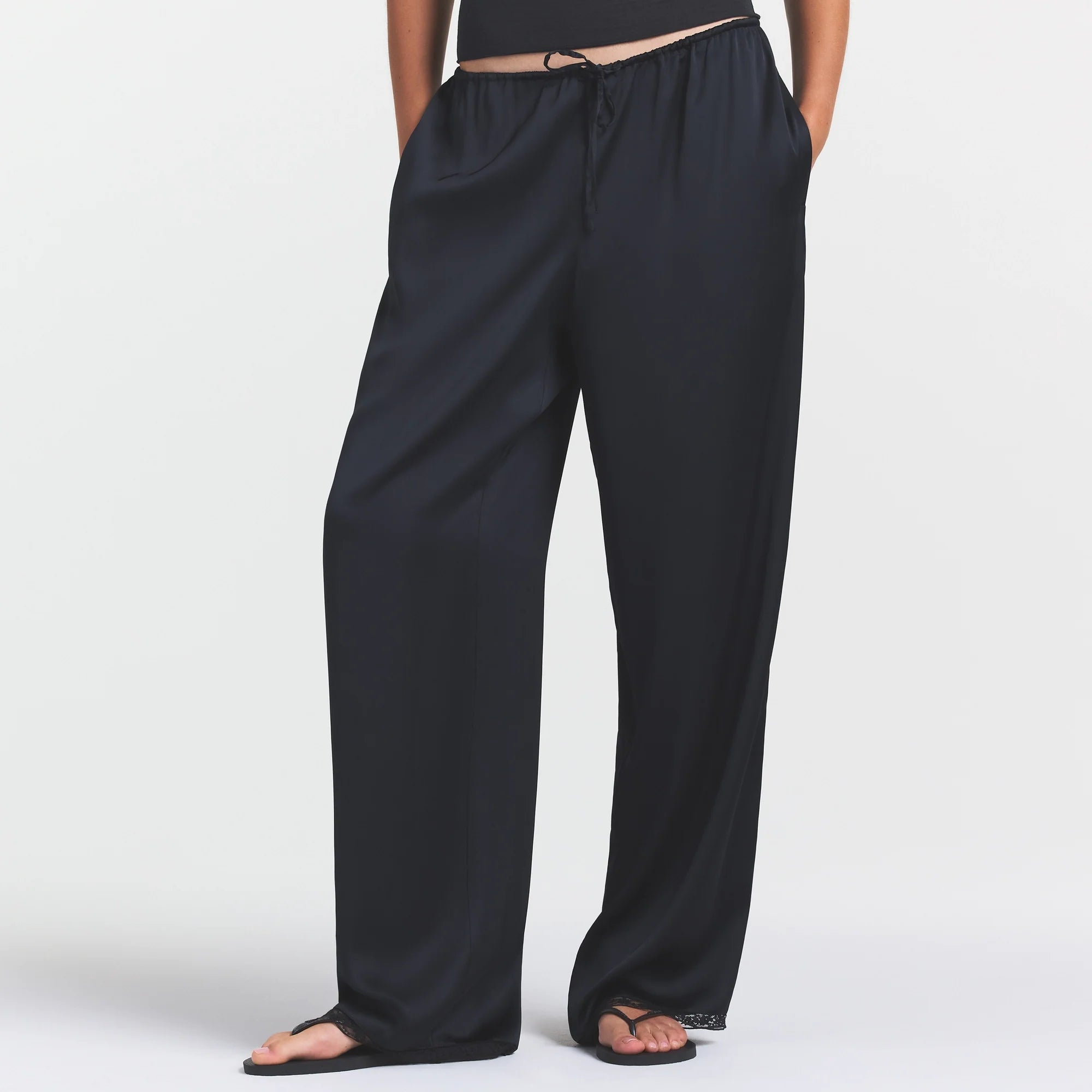 WOVEN SHINE LACE PANT | ONYX ON A MODEL SIDE VIEW @ | FOCUS: 0.0, 1.0, 0.9