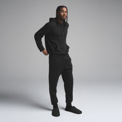 FLEECE LOUNGE MENS TAPERED JOGGER | WASHED ONYX ON A MODEL SIDE VIEW | FOCUS: 0.0, 1.0, 0.9