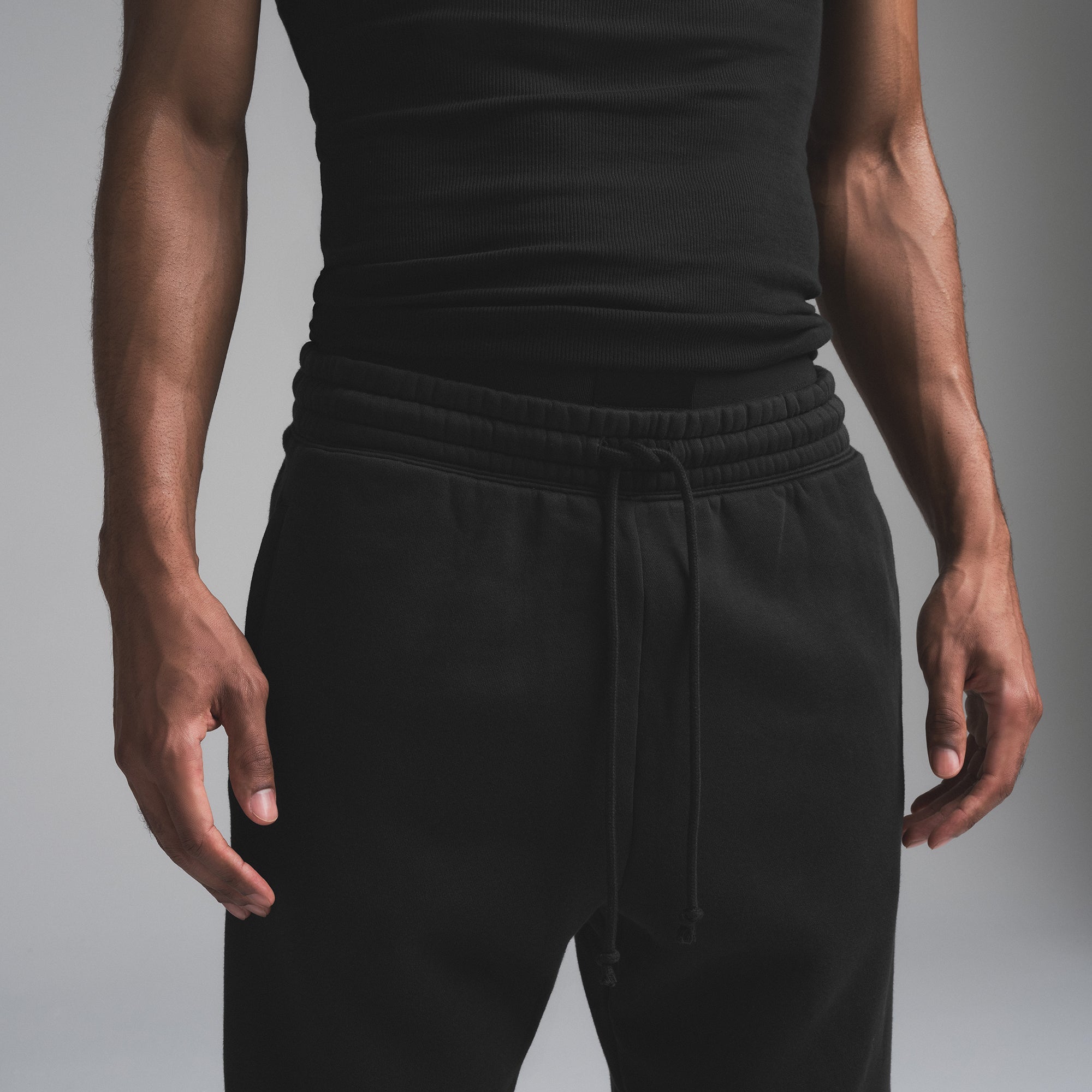 FLEECE LOUNGE MENS TAPERED JOGGER | WASHED ONYX ON A MODEL SIDE VIEW | FOCUS: 0.0, 1.0, 0.9